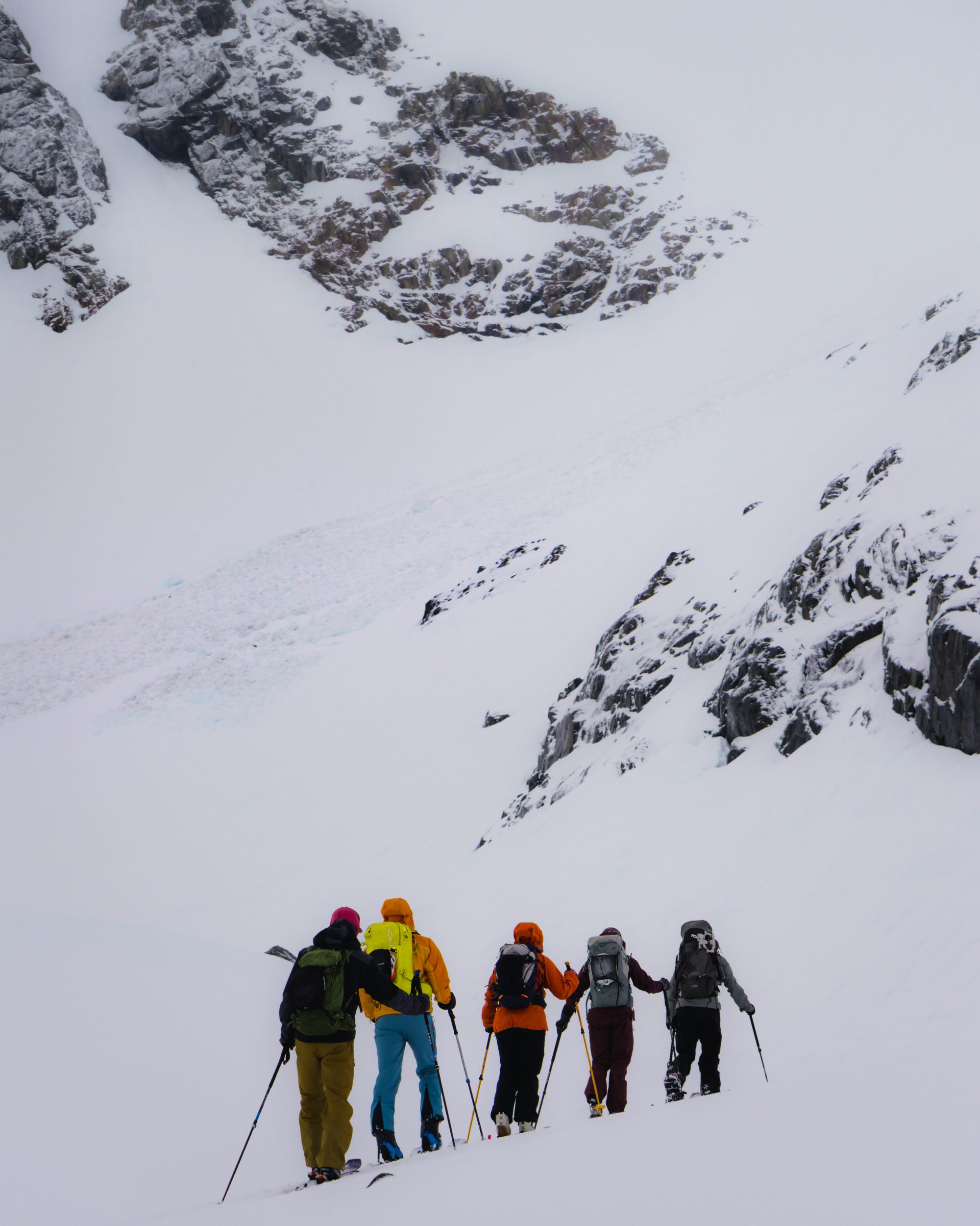 Five skinners traversing under spire