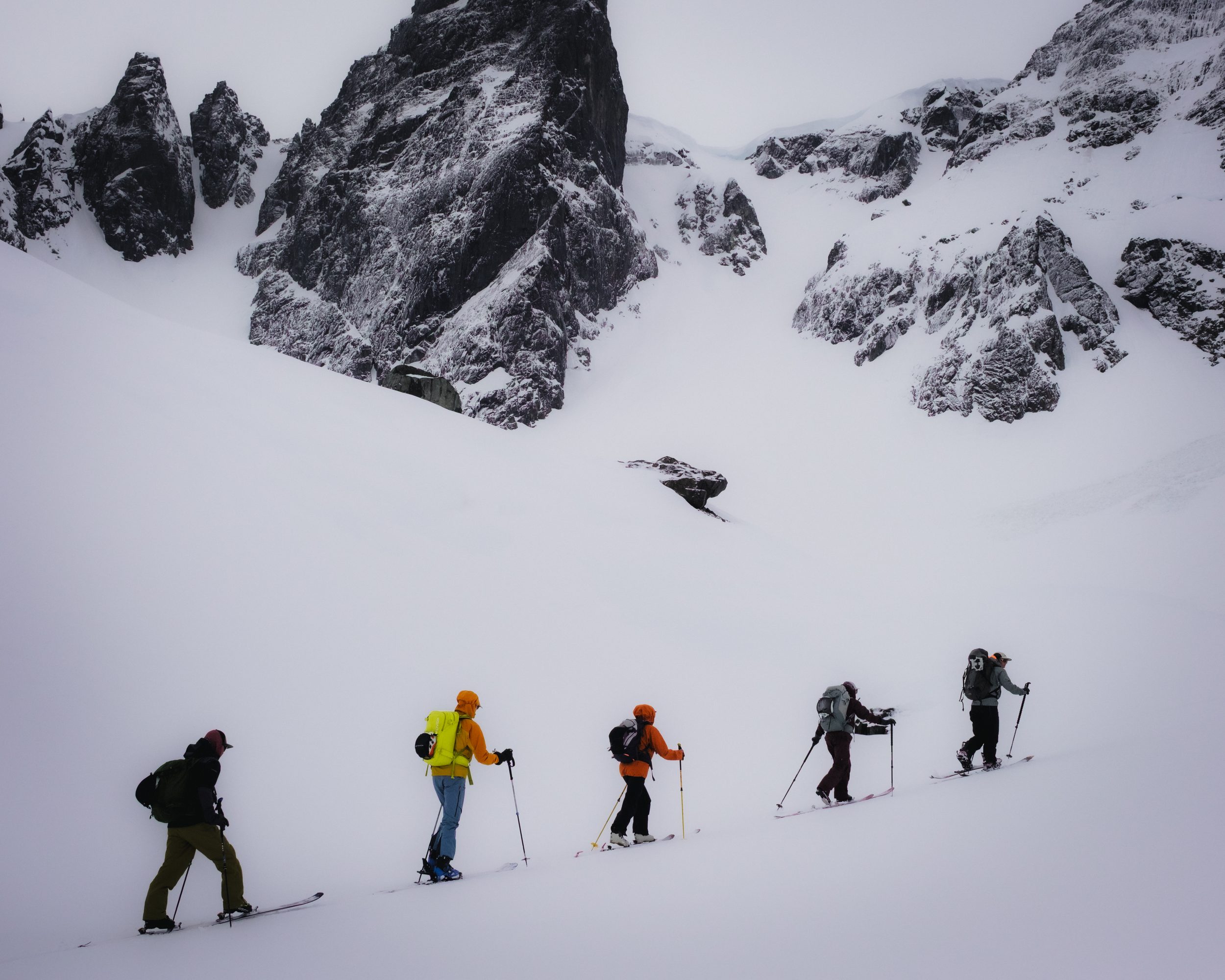 Five skinners under cathedral rock, mist softens distance